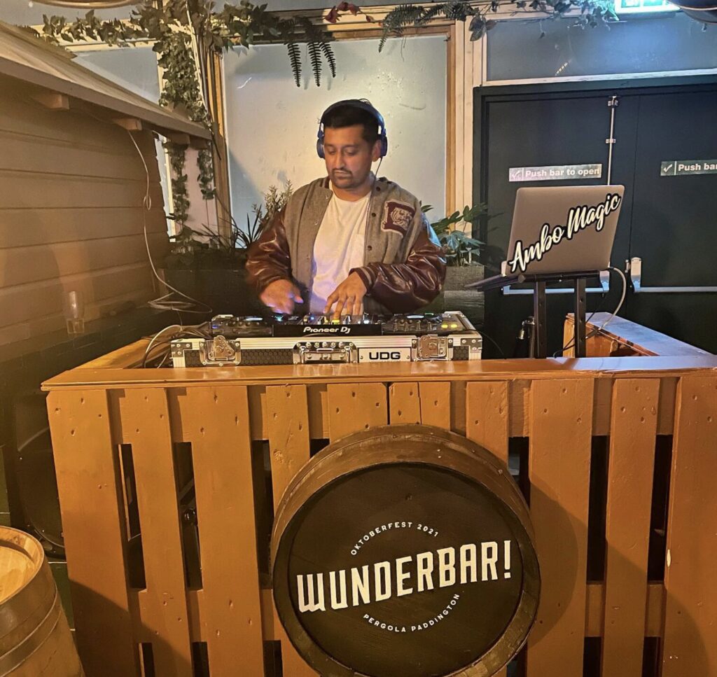 DJ Ambo Magic performing at the decks booth, part of the Party Night London DJ roster