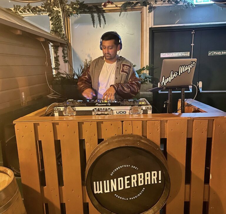 DJ Ambo Magic performing at the decks booth, part of the Party Night London DJ roster