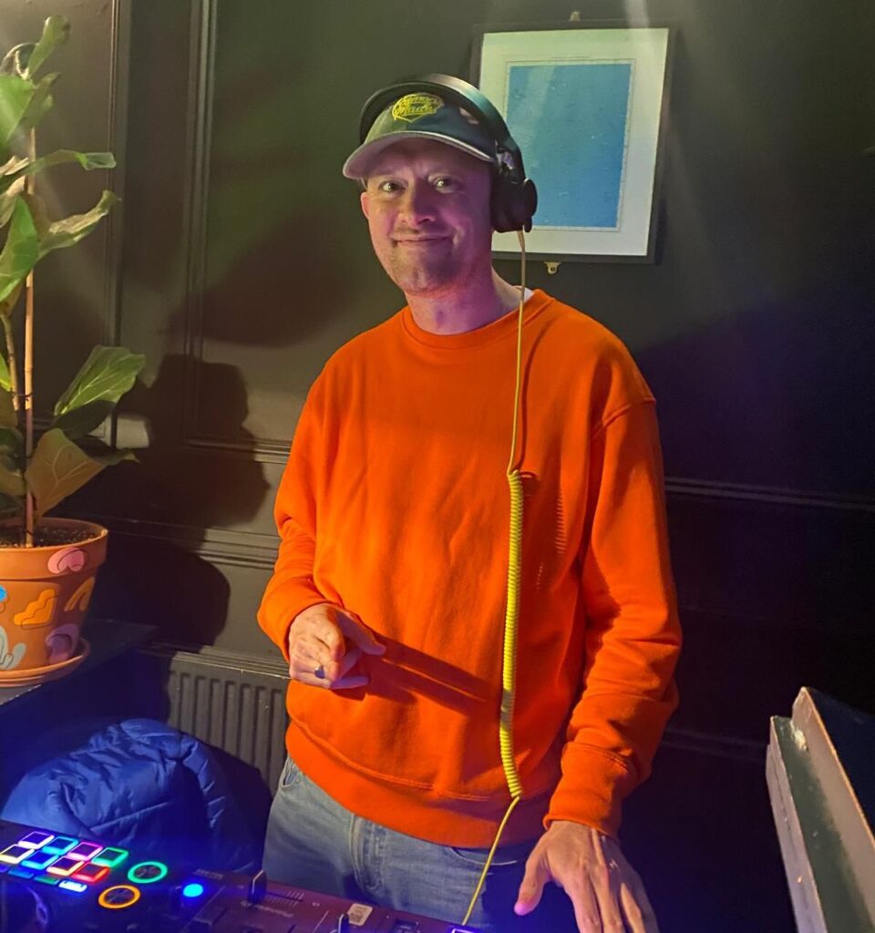 DJ Vek performing at the decks, part of the Party Night London DJ roster