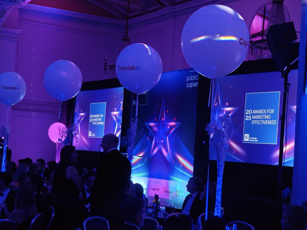 Awards night stage with screens and balloons at a London corporate gala, music by Party Night London