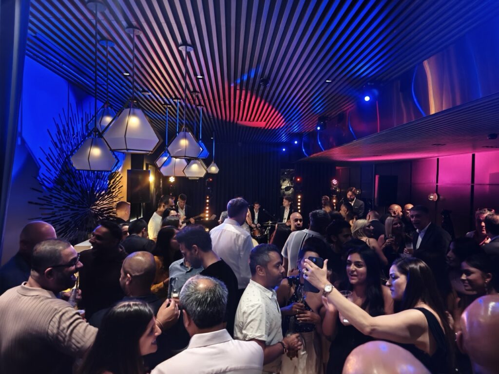 Around 120 guests mingling at a 50th birthday celebration at Amano, Covent Garden